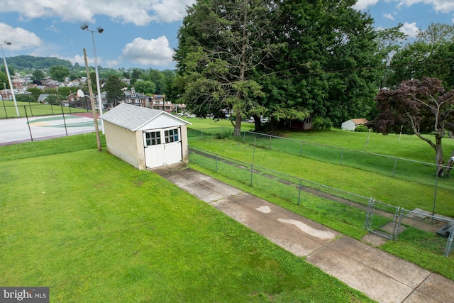 1065 Broadway Blvd, Reading, PA 19607 - view of yard featuring driveway, an outbuilding, and basketball hoop