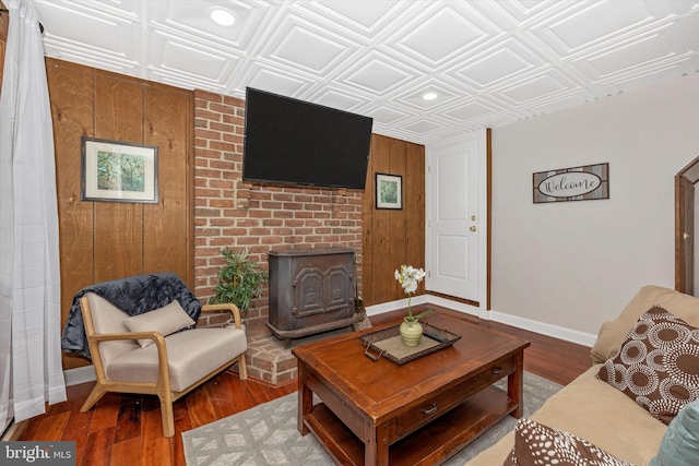 2 Forest Trl, Fairfield, PA 17320 - living area with an ornate ceiling, a wood stove, wood finished floors, wooden walls, and recessed lighting