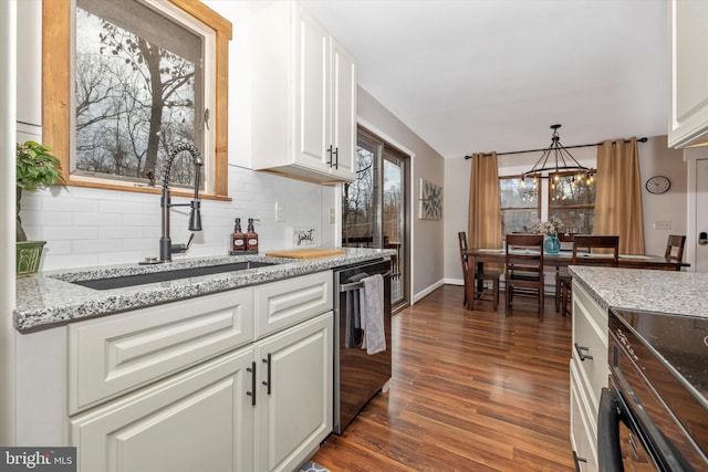 2 Forest Trl, Fairfield, PA 17320 - kitchen with stainless steel dishwasher, dark wood-style floors, tasteful backsplash, white cabinetry, and a chandelier