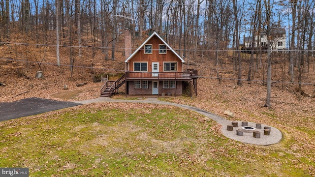2 Forest Trl, Fairfield, PA 17320 - view of front facade featuring an outdoor fire pit, stairway, a deck, a front lawn, and brick siding