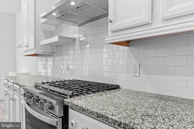 217 Hoke Farm Way, Mechanicsburg, PA 17050 - kitchen featuring stainless steel range with gas stovetop, exhaust hood, white cabinetry, and light stone counters