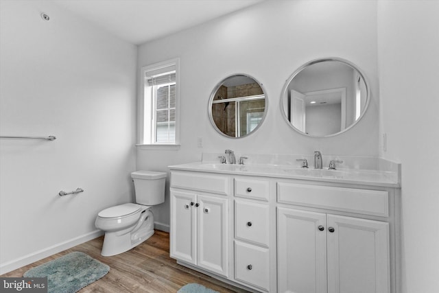 217 Hoke Farm Way, Mechanicsburg, PA 17050 - full bath with double vanity, a tile shower, and wood finished floors