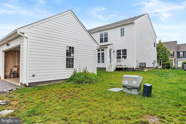 217 Hoke Farm Way, Mechanicsburg, PA 17050 - rear view of house featuring a garage and a yard