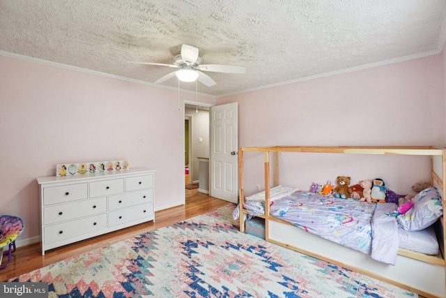 16041 Macedonia Dr, Woodbridge, VA 22191 - bedroom with wood finished floors, ornamental molding, a textured ceiling, and a ceiling fan
