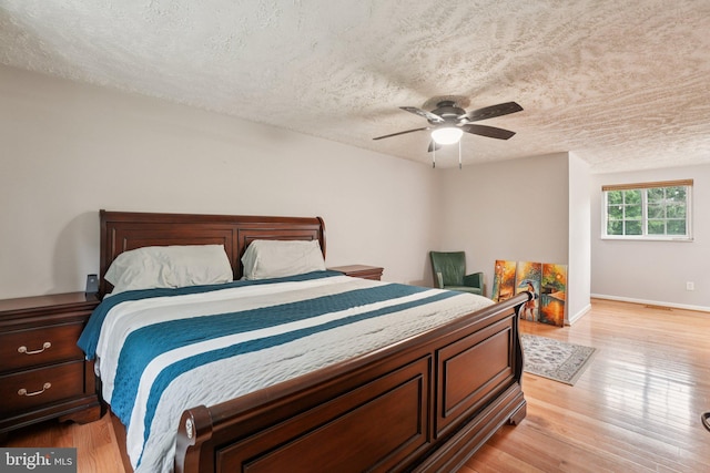 16041 Macedonia Dr, Woodbridge, VA 22191 - bedroom with a textured ceiling, light wood finished floors, and a ceiling fan