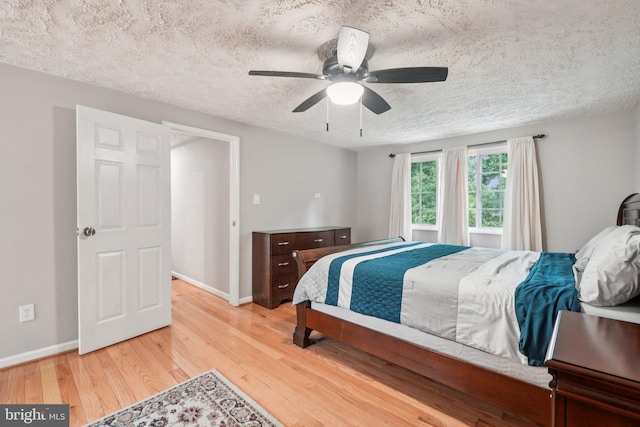 16041 Macedonia Dr, Woodbridge, VA 22191 - bedroom featuring wood finished floors, a textured ceiling, and ceiling fan