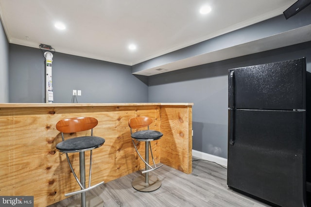 16041 Macedonia Dr, Woodbridge, VA 22191 - indoor bar with freestanding refrigerator, crown molding, wood finished floors, and recessed lighting