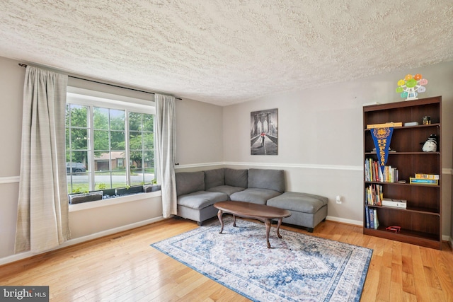 16041 Macedonia Dr, Woodbridge, VA 22191 - living room featuring a textured ceiling and hardwood / wood-style floors