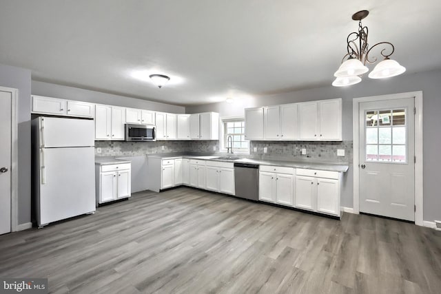 5 Stahle Ln, Dover, PA 17315 - kitchen with stainless steel appliances, white cabinetry, and tasteful backsplash