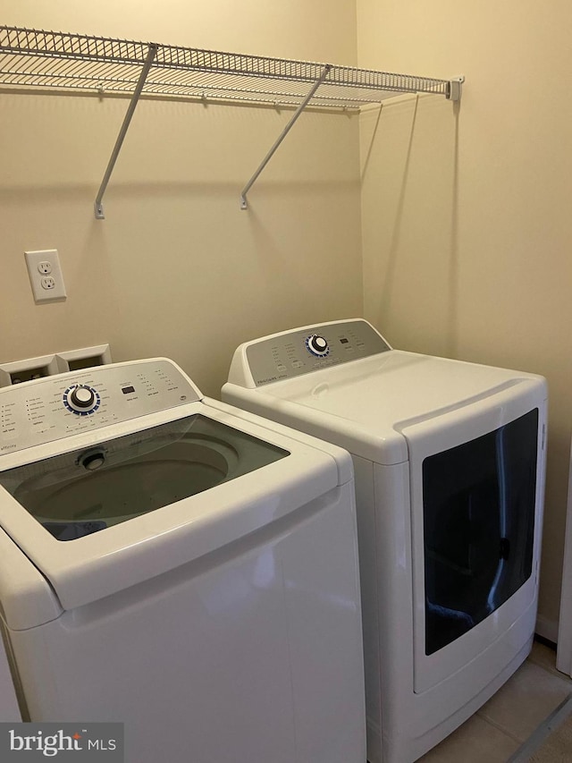 8930 Shadia Pl, Manassas, VA 20110 - laundry area with washer and dryer and tile patterned flooring