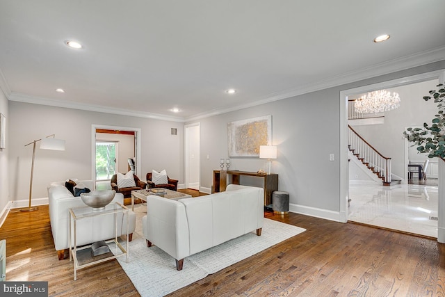9118 Bells Mill Rd, Potomac, MD 20854 - living area featuring stairs, recessed lighting, wood finished floors, and ornamental molding