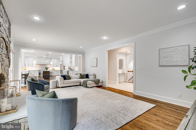 9118 Bells Mill Rd, Potomac, MD 20854 - living area featuring crown molding, wood finished floors, and recessed lighting