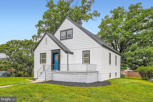 3814 Cedardale Rd, Baltimore, MD 21215 - bungalow-style house featuring a chimney, a front lawn, and brick siding