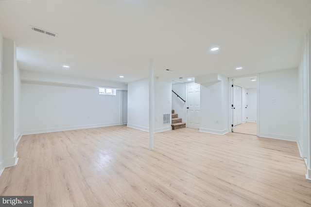 3814 Cedardale Rd, Baltimore, MD 21215 - basement featuring light wood finished floors, stairway, and recessed lighting