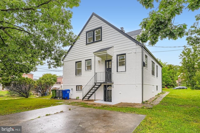 3814 Cedardale Rd, Baltimore, MD 21215 - view of front of property featuring a front lawn and a patio