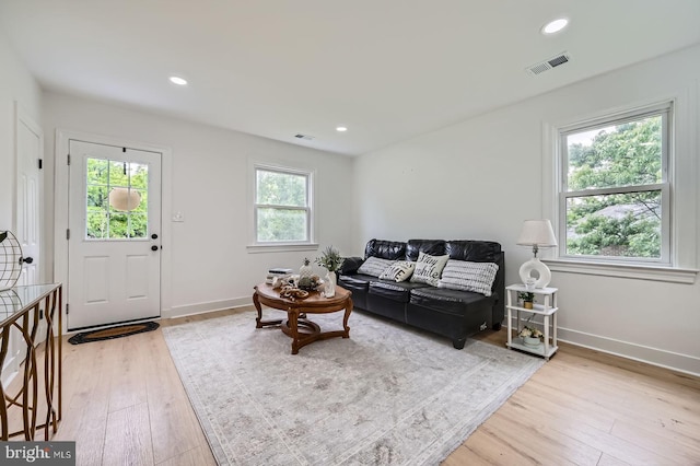 3814 Cedardale Rd, Baltimore, MD 21215 - living area with light wood-style floors and recessed lighting