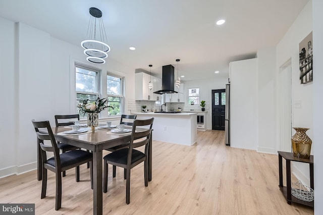 3814 Cedardale Rd, Baltimore, MD 21215 - dining room featuring healthy amount of natural light, light wood finished floors, recessed lighting, and a chandelier