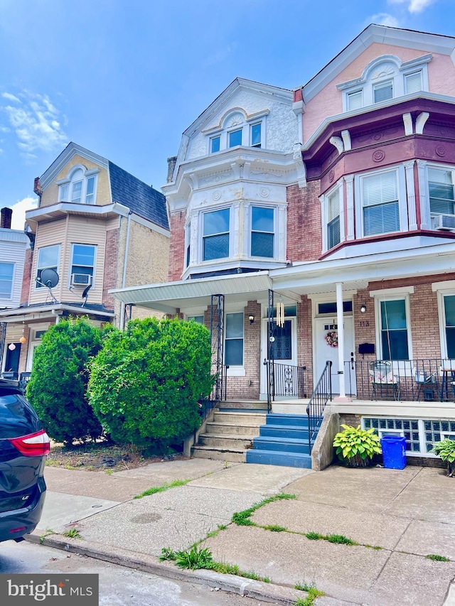 115 W Sharpnack St, Philadelphia, PA 19119 - multi unit property with brick siding, covered porch, and cooling unit