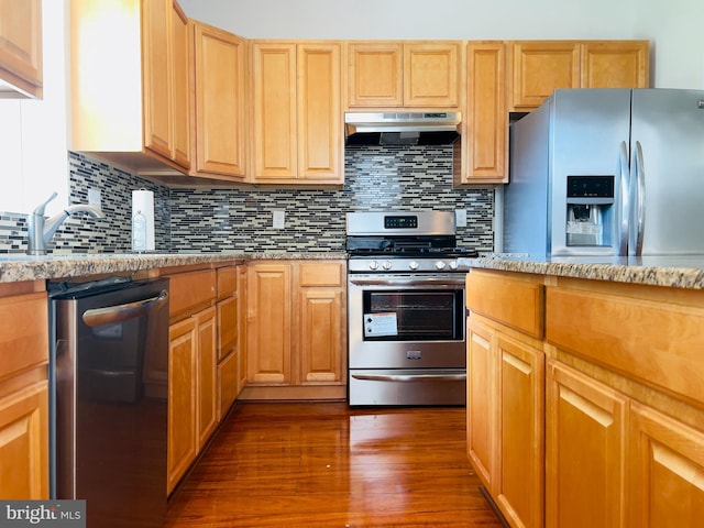 115 W Sharpnack St, Philadelphia, PA 19119 - kitchen featuring stainless steel appliances, under cabinet range hood, dark wood-style floors, tasteful backsplash, and light stone countertops