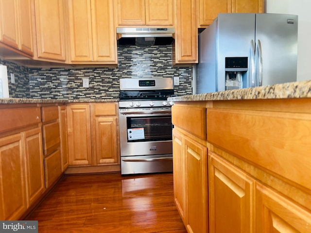 115 W Sharpnack St, Philadelphia, PA 19119 - kitchen featuring appliances with stainless steel finishes, under cabinet range hood, dark wood-style flooring, and decorative backsplash