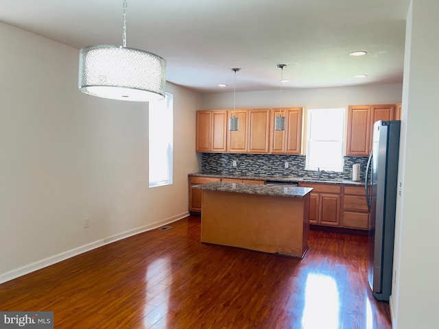 115 W Sharpnack St, Philadelphia, PA 19119 - kitchen with freestanding refrigerator, a kitchen island, backsplash, dark wood-style flooring, and recessed lighting