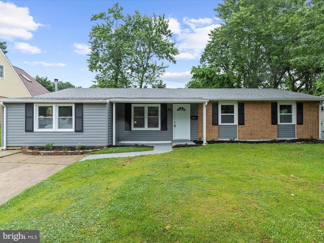 813 Ferguson Rd, Joppa, MD 21085 - single story home with a porch, a front lawn, brick siding, and roof with shingles