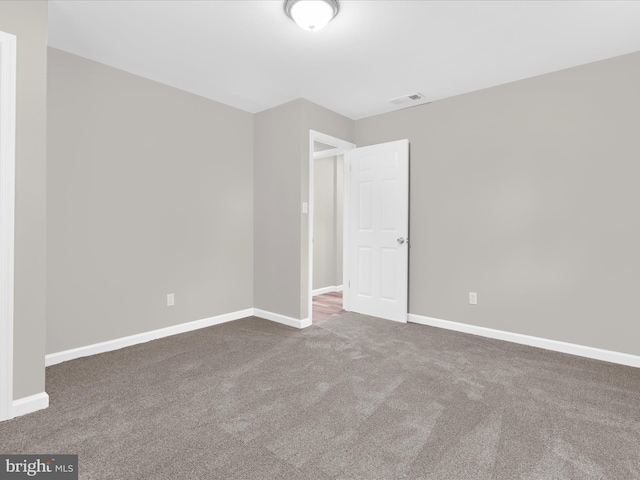 813 Ferguson Rd, Joppa, MD 21085 - carpeted empty room with baseboards