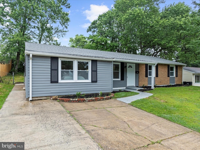 813 Ferguson Rd, Joppa, MD 21085 - view of front facade with covered porch, brick siding, and roof with shingles