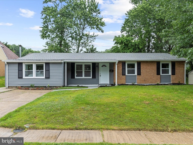 813 Ferguson Rd, Joppa, MD 21085 - ranch-style house featuring a front lawn, brick siding, and a shingled roof