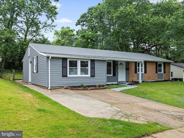 813 Ferguson Rd, Joppa, MD 21085 - ranch-style home featuring a front yard, covered porch, roof with shingles, and brick siding