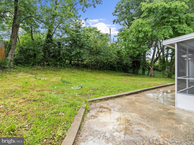 813 Ferguson Rd, Joppa, MD 21085 - view of grassy yard featuring a sunroom