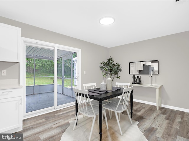 813 Ferguson Rd, Joppa, MD 21085 - dining area with light wood-type flooring and baseboards