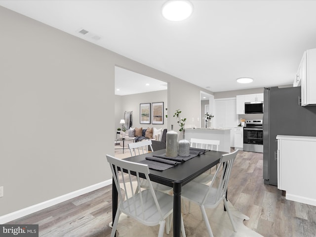 813 Ferguson Rd, Joppa, MD 21085 - dining room with light wood-type flooring and recessed lighting