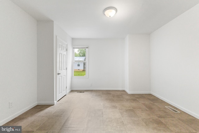 211 Broad St, Beverly, NJ 08010 - empty room featuring baseboards