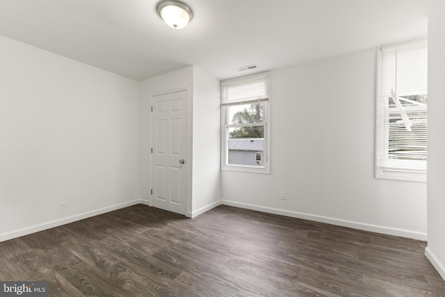 211 Broad St, Beverly, NJ 08010 - empty room featuring dark wood-style floors and baseboards