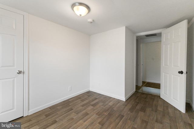211 Broad St, Beverly, NJ 08010 - unfurnished bedroom featuring wood finished floors