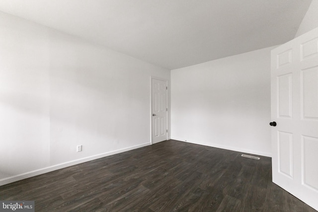 211 Broad St, Beverly, NJ 08010 - spare room with dark wood-type flooring