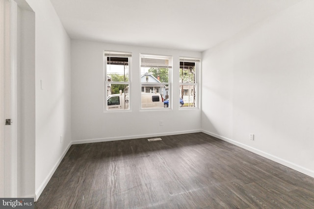 211 Broad St, Beverly, NJ 08010 - spare room featuring wood finished floors and baseboards