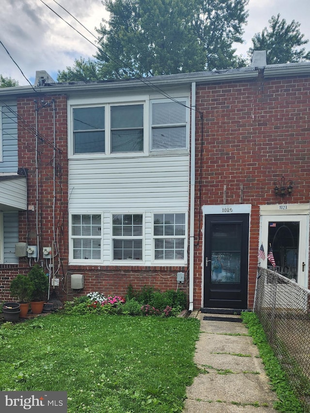 1025 Fredonia Ct, Baltimore, MD 21227 - townhome / multi-family property featuring brick siding