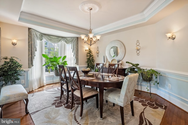 3716 Taft Ave, Alexandria, VA 22304 - dining room with hardwood / wood-style flooring, a chandelier, a tray ceiling, and ornamental molding