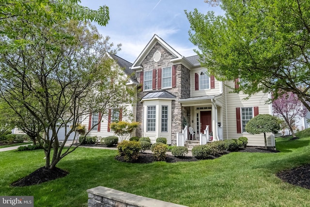 3716 Taft Ave, Alexandria, VA 22304 - traditional-style house featuring stone siding and a front lawn