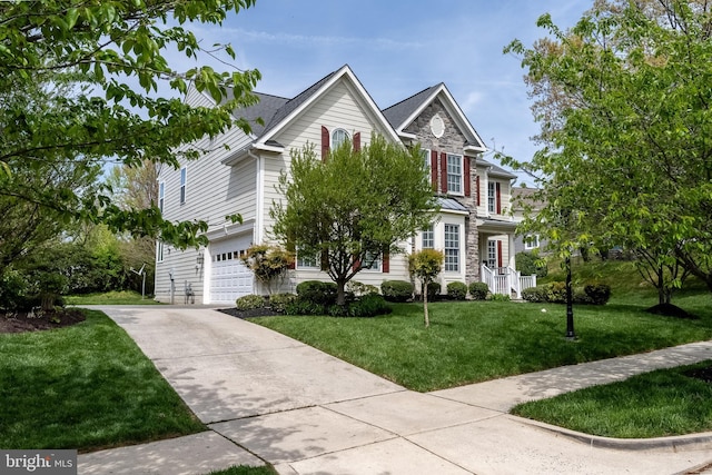 3716 Taft Ave, Alexandria, VA 22304 - traditional home with an attached garage, driveway, a front yard, and stone siding