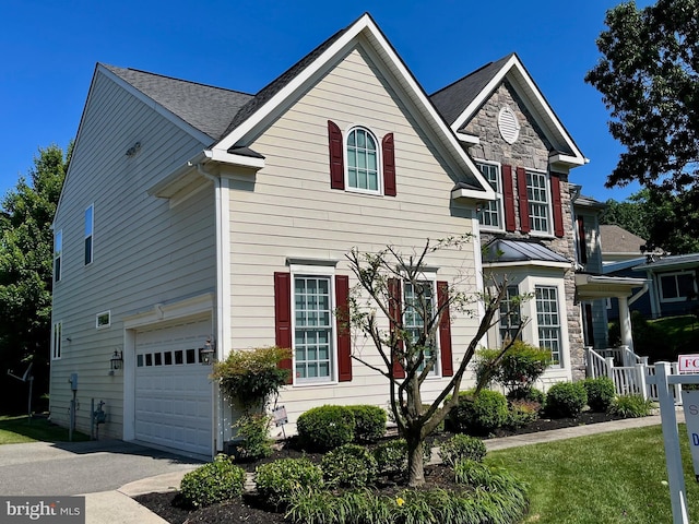 3716 Taft Ave, Alexandria, VA 22304 - traditional-style home with a garage, stone siding, and driveway