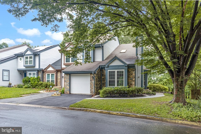 1651 Hugo Cir, Silver Spring, MD 20906 - view of front facade featuring stone siding, asphalt driveway, a front yard, and an attached garage