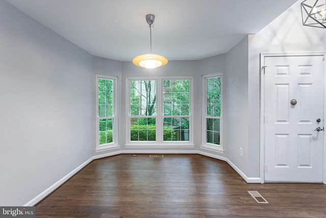 1651 Hugo Cir, Silver Spring, MD 20906 - unfurnished dining area with dark wood finished floors and baseboards