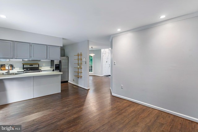 1651 Hugo Cir, Silver Spring, MD 20906 - kitchen featuring stainless steel appliances, light countertops, dark wood finished floors, a peninsula, and gray cabinets