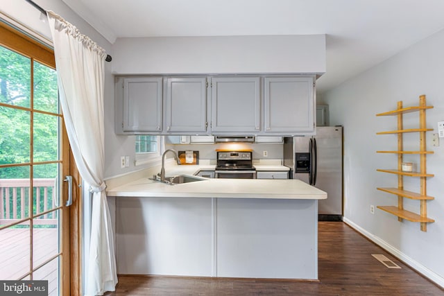 1651 Hugo Cir, Silver Spring, MD 20906 - kitchen with appliances with stainless steel finishes, a peninsula, gray cabinets, light countertops, and under cabinet range hood