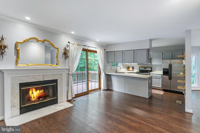 1651 Hugo Cir, Silver Spring, MD 20906 - kitchen with stainless steel appliances, gray cabinets, a peninsula, light countertops, and dark wood-type flooring