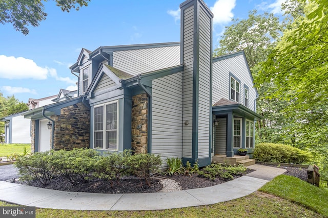 1651 Hugo Cir, Silver Spring, MD 20906 - view of home's exterior featuring stone siding and a chimney