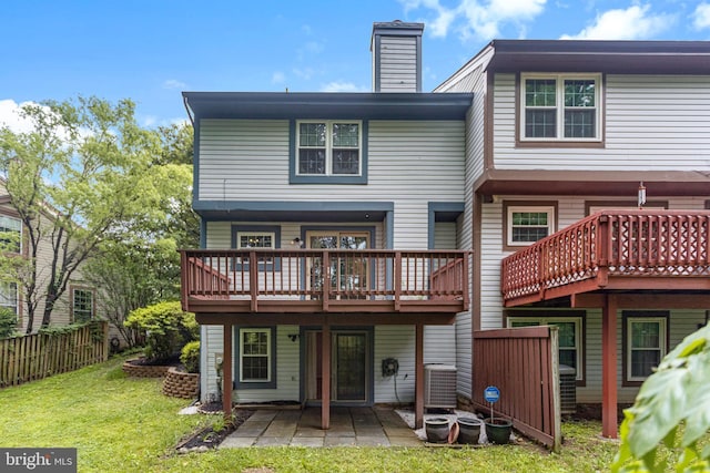 1651 Hugo Cir, Silver Spring, MD 20906 - rear view of house featuring a patio, a wooden deck, and a chimney